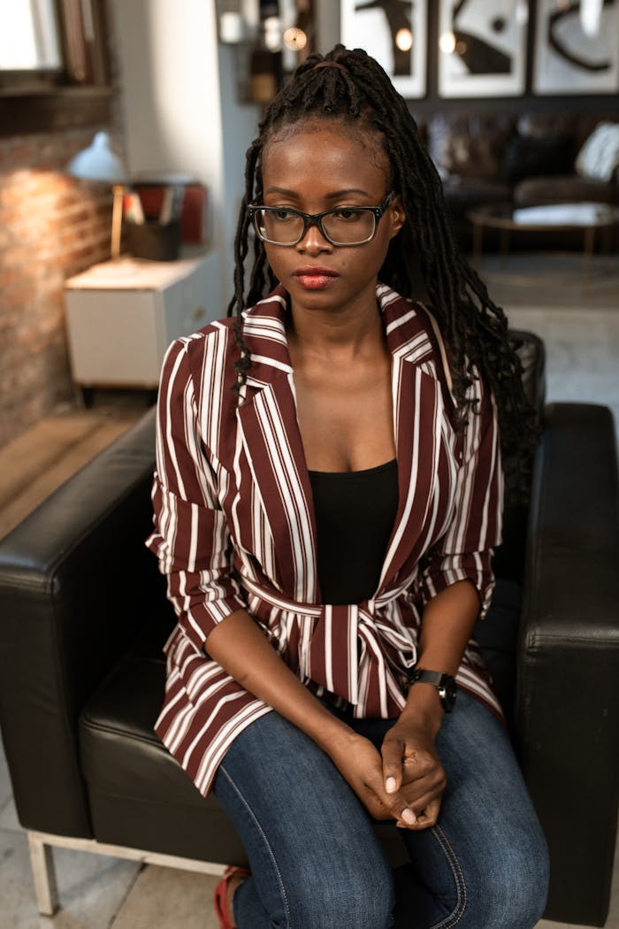 Businesswoman in a stylish office setting exuding confidence and professionalism.